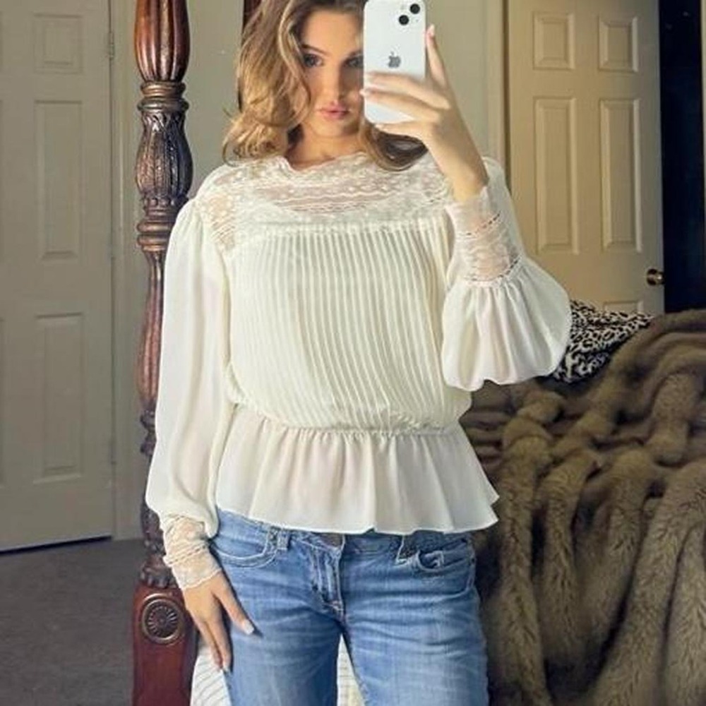 vintage white blouse with lace detailing and ruffled sleeves